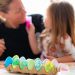 Family. Mom and daughter decorating eggs