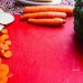 sliced carrots on red board