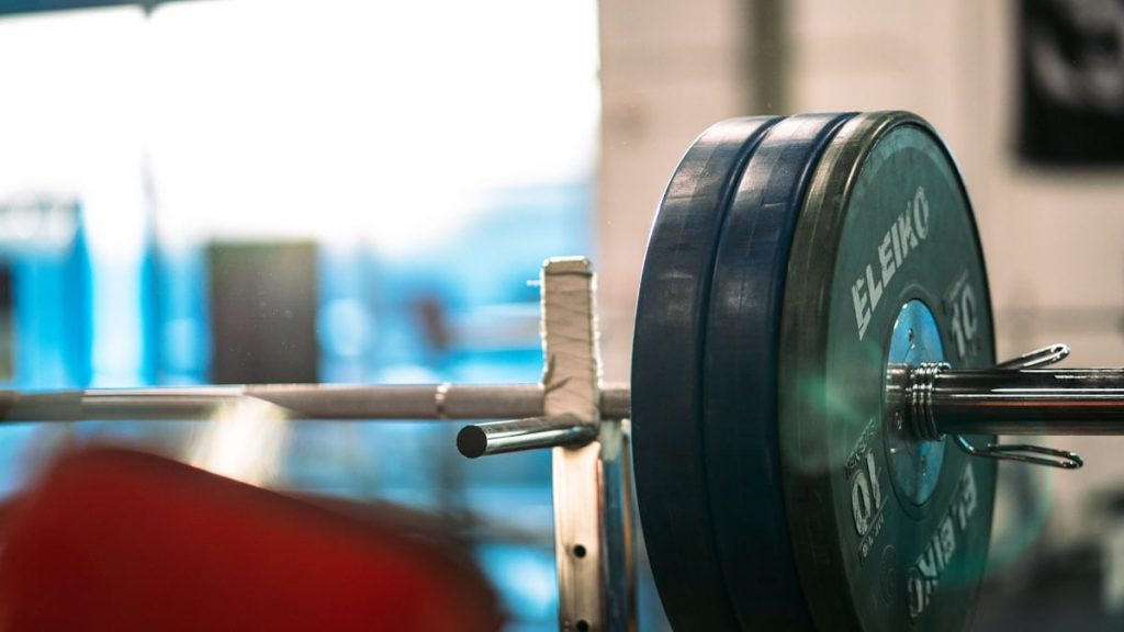 black and gray barbell bar